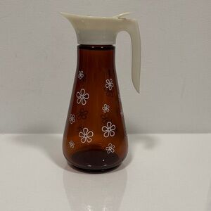 Vintage 1960’s Thatcher Amber Glass Syrup pitcher with White Floral Design.